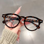 A high-end, retro Korean-style round frame anti-blue light flat glasses with a simple round frame and rice studs without makeup